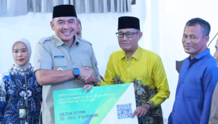 Bupati Tala Launching Perlindungan BPJS Ketenagakerjaan Ketua RT dan RW se Tala